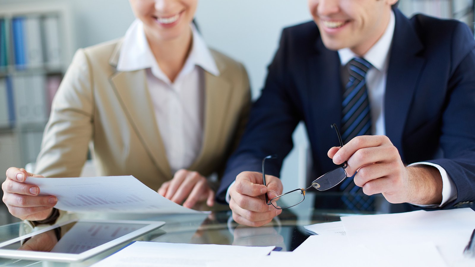 Business partners discussing document at meeting